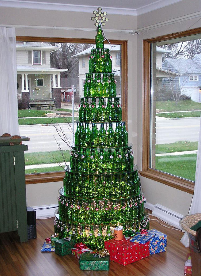 a christmas tree made out of empty beer bottles